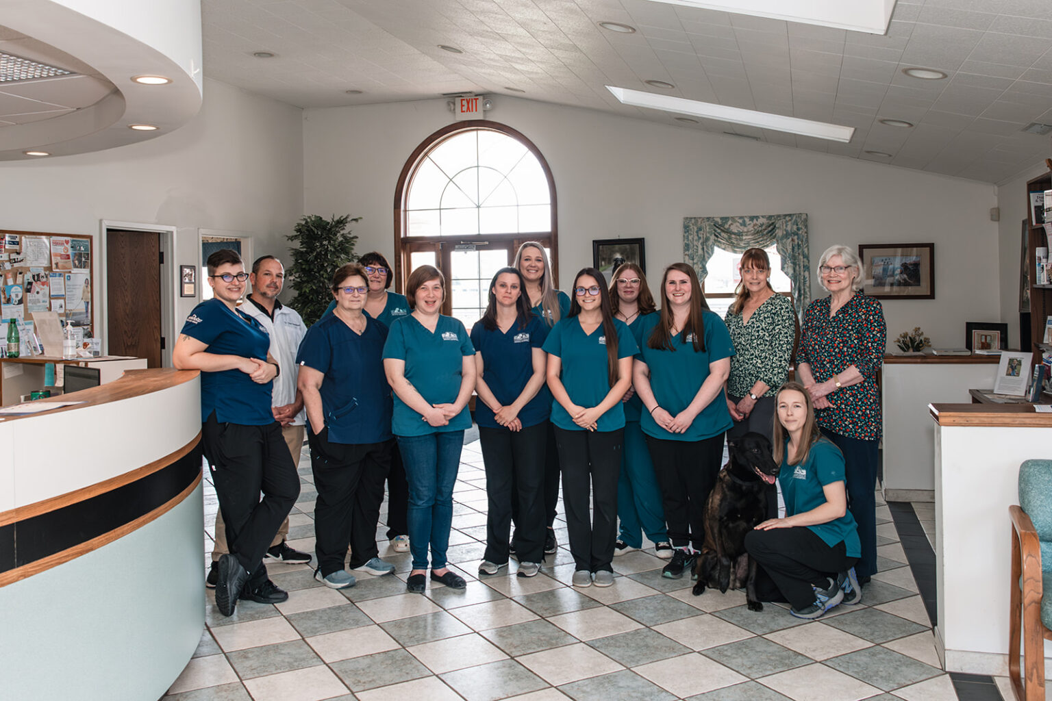 Veterinary team standing together in the lobby of Community Animal Hospital in Easton, MD.